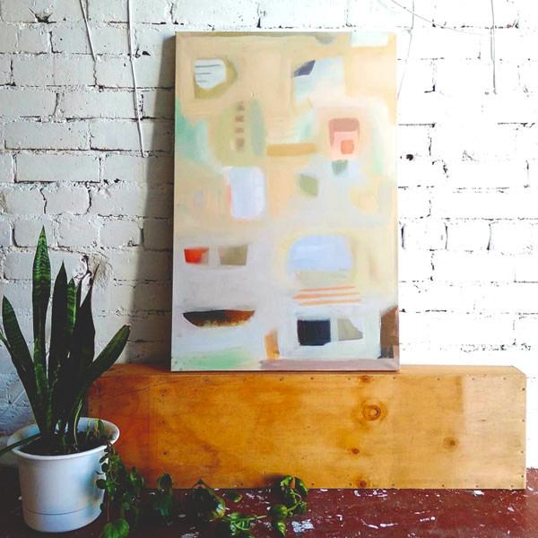A photo of one of Mandys latest abstract paintings styled in her art garden gallery 