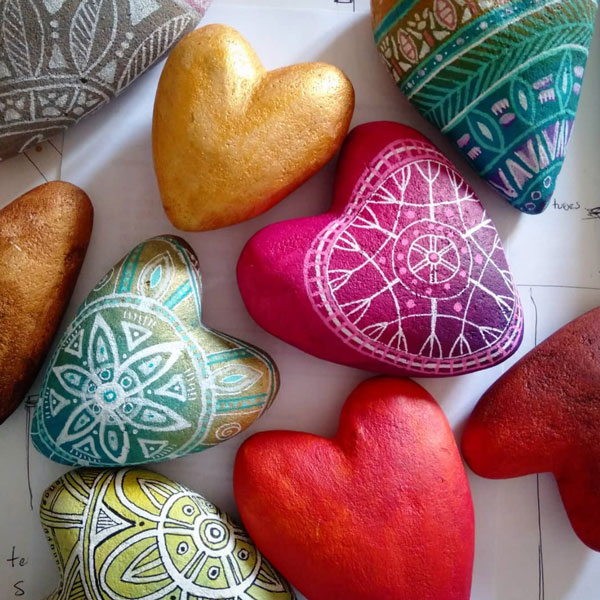 a group of painted hearts in gorgeous colours 