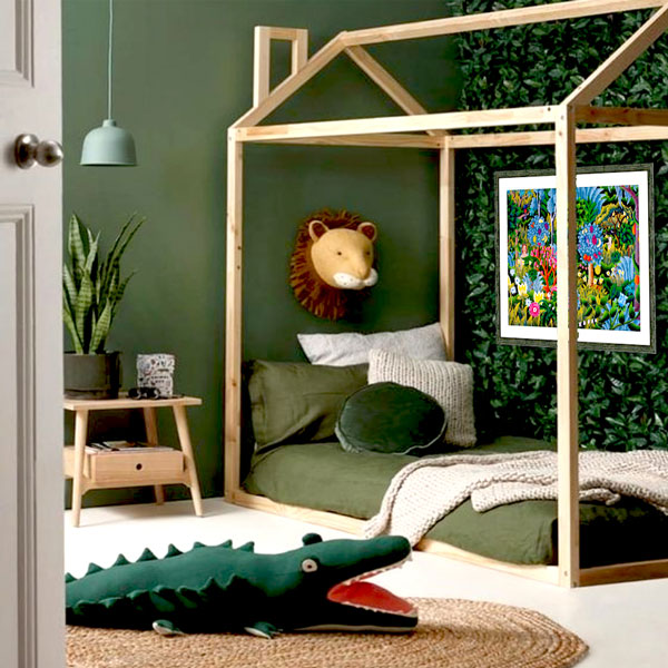 the jungle picture framed print on the wall of a jungle themed bedroom with a leafy wall
