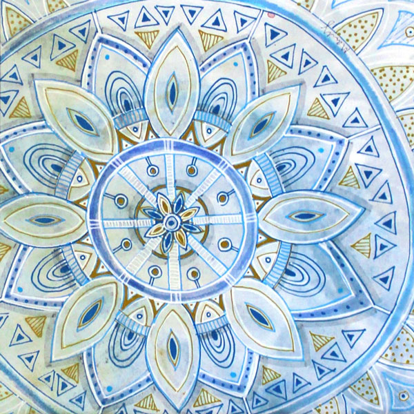 a gorgeous blue background with a mandala pattern