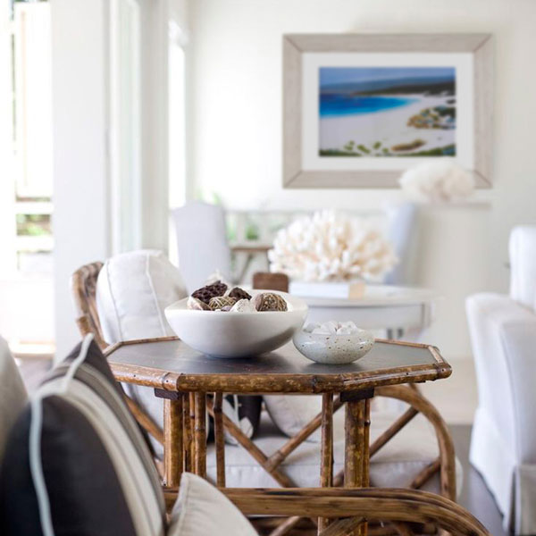 an insitue photograph of the smith beach limited edition in a beachy type home with dark natural wood furniture