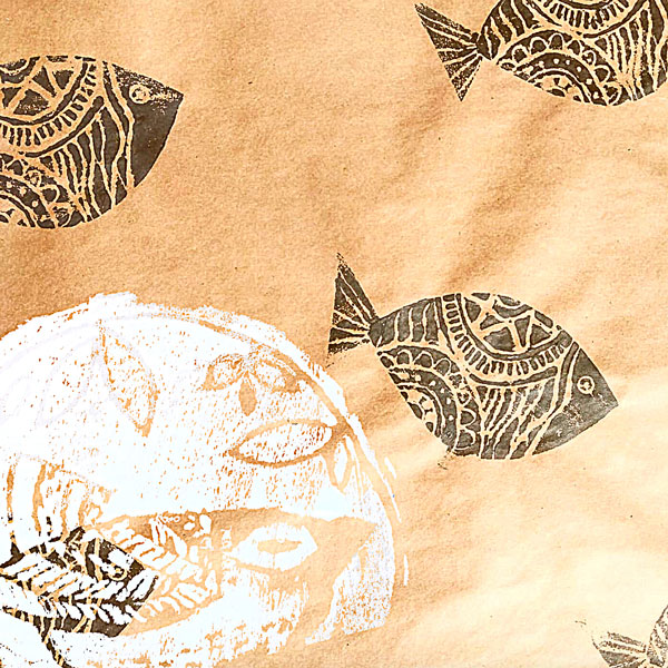 an example of a fish stamp in dark grey on brown paper