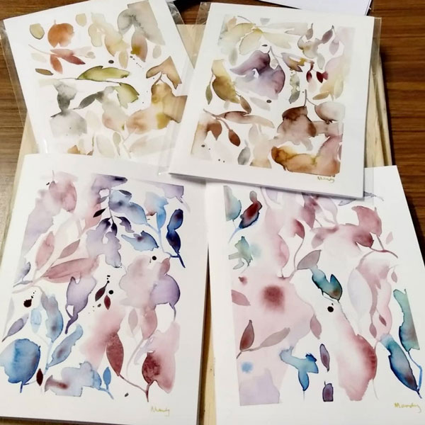 a collection of watercolour notebooks painted with a botanical technique
