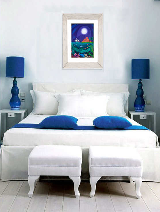 A framed limited edition print of Moon Woman on the same bedroom wall 